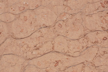 Pink stone with cracks, called Perlino Rosato