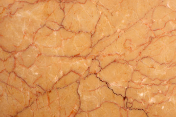 The bright surface of a yellow natural stone with red stripes is called Crema Valencia
