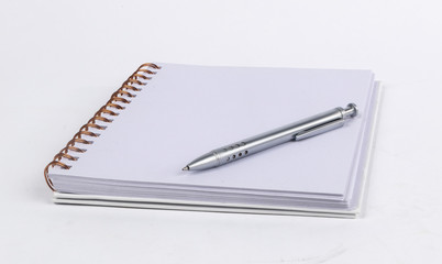 Empty notebook with pen