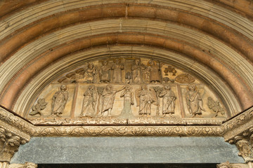 BELLINZONA, SWITZERLAND - APRIL 2013; Art objects above the entrance of Bellinzona Cathedral