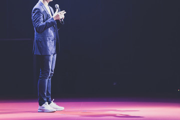 speaker on stage in a conference room