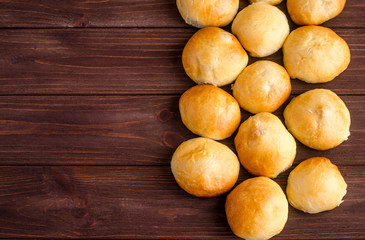Baked homemade pies in the oven with mashed potatoes and fried onions