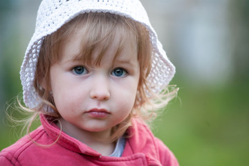 blue-eyed little child caucasian girl face closeup