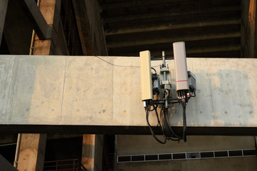 Telecommunication mast television antenna. Telecommunication Tower in Evening Light.tower with antennas against blue sky.Antennas on the top of a high building.