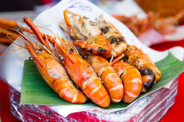 Grilled shrimps seafood on the table in market of Bangkok Thailand 