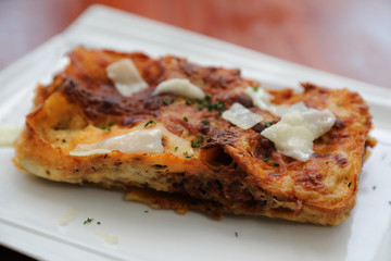 Beef lasagna on wooden background , Italian food