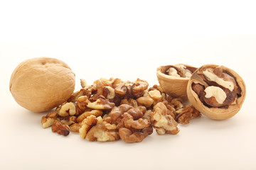A pile of peeled walnuts at white background	