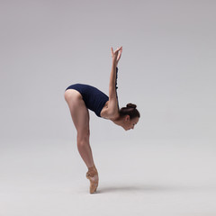 beautiful ballet dancer posing on pointes.