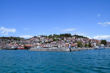 Fototapeta na wymiar Harbor panorama of Ohrid town with Tsar Samuel fortress. Ochrid Lake with mountains background. Ohrid, Macedonia