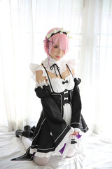 Portrait of Japan anime cosplay woman , white japanese maid in white tone room