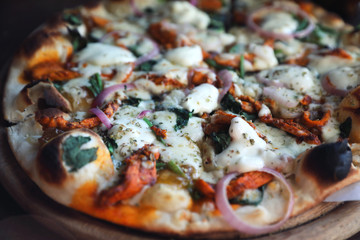Fototapeta na wymiar Tandoori Chicken Pizza on wooden table