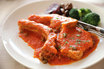Pork chop steak with tomato sauce and mushroom , Italian food
