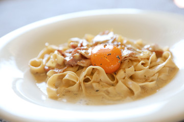 Homemade pasta with white sauce , spaghetti carbonara , italian food