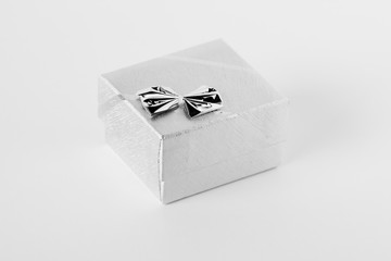silver gift box with bow isolated on white background