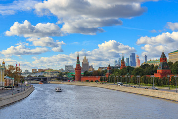 Fototapeta premium Panorama of Moskva river near Moscow Kremlin in sunny day against blue sky with white clouds