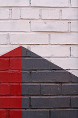 Colorful (white, grey and red) brick wall as background, texture