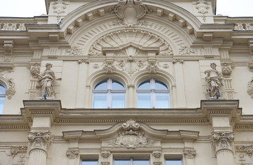 Facade details of old building on Porici Street in Prague.