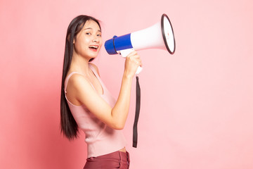 Beautiful young Asian woman announce with megaphone.
