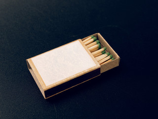 sulfur matches in a box on a black background