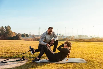  Personal trainer training a girl on the outside © OSORIOartist