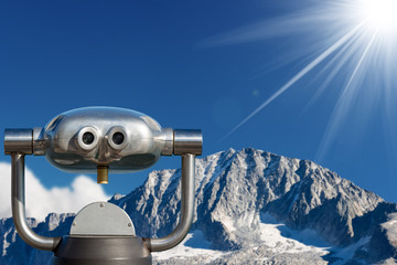 Coin operated binoculars on a mountain landscape