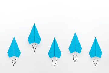 Blue paper planes on white background. Business competition concept.