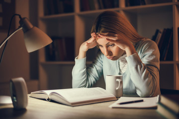Tired student learning at home