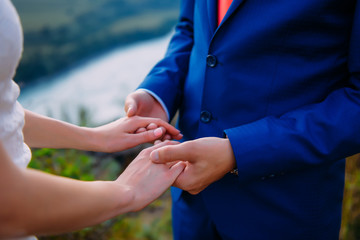 Fototapeta premium wedding theme, holding hands newlyweds