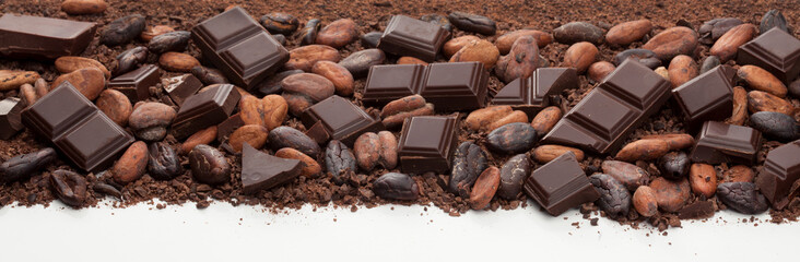 Chocolate bar pieces, cocoa beans and cocoa powder mix