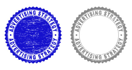 ADVERTISING STRATEGY stamp seals with grunge texture in blue and grey colors isolated on white background. Vector rubber imitation of ADVERTISING STRATEGY tag inside round rosette.