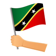 Saint Kitts and Nevis flag in hand