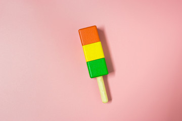 Children’s toy wood. Colorful of ice cream toy on pink background. Eating in summer for fresh