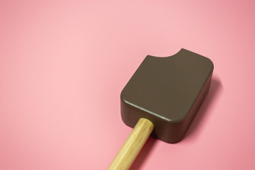 Ice cream chocolate on pink background, wooden toy of children