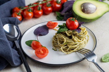 Appetizer Italian pasta with pesto and cherry tomatoes