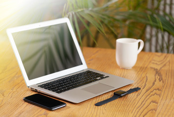 Fototapeta premium laptop and cup of coffee on the table