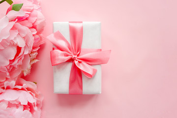 Spring composition with gift boxes on table top view. Greeting card for Birthday, Woman or Mothers Day. Flat lay.