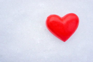 Valentines Day love heart in winter in the snow from above