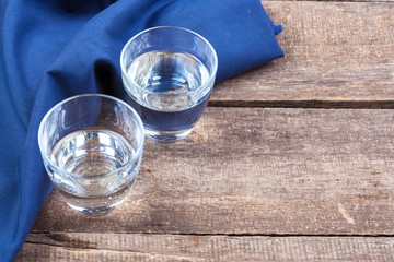 Glass of water on a wooden table