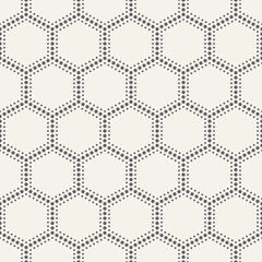 Abstract seamless pattern of dotted hexagons.