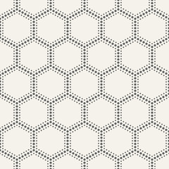 Abstract seamless pattern of dotted hexagons.