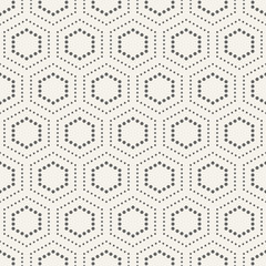Abstract seamless pattern of dotted hexagons.