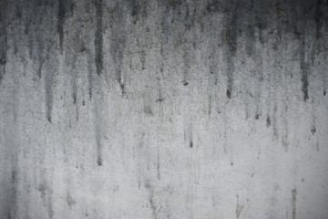 old dirty monochrome background with dripping stain on the wall, detail of texture of black trickle...