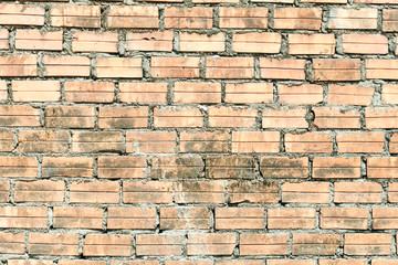 Light brick wall. Horizontal wide brickwall background. Distressed wall with broken bricks texture.