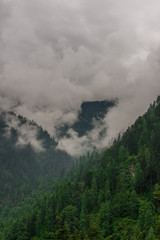 mountain range view. Timelapse Of Moving Clouds And Fog over Himalayan mountain range in Sainj