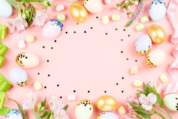 Festive Happy Easter background with decorated eggs, flowers, candy and ribbons in pastel colors on white. Copy space