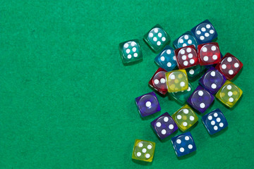 Different dices on green background.