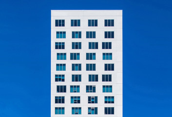 View of modern building against blue sky