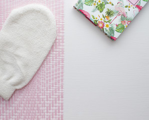 Flat layout bath with notebook on white and pink background