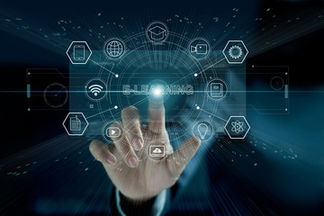 E-learning concept. Businessman touching a modern virtual interface with icon  E-LEARNING of the...