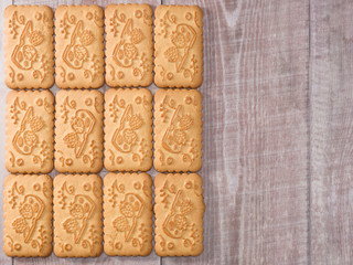 Twelve cookies on wooden background